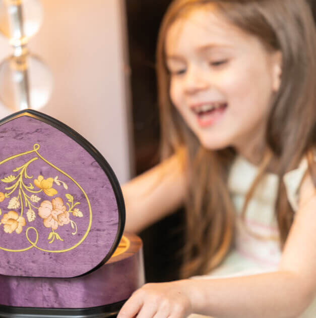 girl with purple floral music box