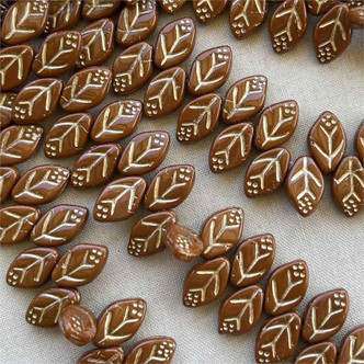 12x7mm Gilded Auburn Pressed Leaf Czech Glass 25 Beads Per Strand