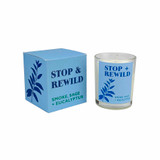 Heaven Scent Modern Botanical Stop & Rewild candle in glass jar next to its blue box with botanical illustration. Scent notes: Smoke, Sage and Eucalyptus. Vegan soy wax.