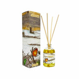 Heaven Scent 100ml reed diffuser in Cold Still Days scent. The clear apothecary glass bottle is illustrated with a robin, beside a tall illustrated gift box showing a robin and a country church in the snow. The fragrance is nutmeg orange and cinnamon.