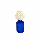 Handmade Lotus sola flower diffuser in a pretty blue ribbed glass bottle.
