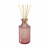 Empty vintage style pink ribbed bottle for reed diffusers, posies and decoration.