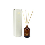 Heaven Scent Christmas Winter Scent diffuser in aa brown apothecary bottle with gold label depicting a lodge printed in gold, pictured in a white box with matching label..
