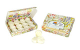 A box of Garden Picnic scented wax melts in the shape of roses, shown inside their illustrated gift box and resting beside it. The FSC-certified packaging features a detailed garden illustration by Sarah Pettitt, depicting a round table with a chequered cloth, a bowl of fruit and a tea cup surrounded by a field of colourful flowers.