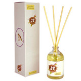 A Heaven Scent 100ml clear apothecary glass reed diffuser bottle with four natural reeds, standing next to its tall white gift box. Both the bottle and box feature a delicate watercolour illustration of a bird's nest with four speckled eggs and a small songthrush bird in a circular purple frame.