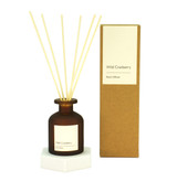A Heaven Scent Alcohol Free Wild Cranberry Reed Diffuser in an amber tulip bottle, with kraft brown gift box.
