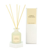 Heaven Scent Amber & Tonka Bean alcohol-free reed diffuser in a frosted white tulip glass, pictured with a white gift box