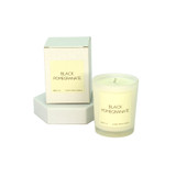 Noir/Black Pomegranate vegan soy wax candle in a white gloss glass votive, presented next to a beautiful luxury gift box.