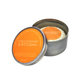 Heaven Scent natural vegan shaving soap bar inside an open metal travel tin featuring a warm orange heritage label, scented with Citrus, Rosemary and Petitgrain.