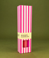 A beautifully illustrated, pink and white stripy gift box for Heaven Scent's The Pink Edit mixed dinner candles, displayed alongside six straight, hand-poured artisan dinner candles in complementary shades of Pastel Pink, Raspberry Pink and Bubblegum Pink.