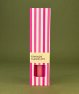A beautifully illustrated, pink and white stripy gift box for Heaven Scent's The Pink Edit mixed dinner candles, displayed alongside six straight, hand-poured artisan dinner candles in complementary shades of Pastel Pink, Raspberry Pink and Bubblegum Pink.