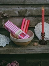 A beautifully illustrated, pink and white stripy gift box for Heaven Scent's The Pink Edit mixed dinner candles, displayed alongside six straight, hand-poured artisan dinner candles in complementary shades of Pastel Pink, Raspberry Pink and Bubblegum Pink.