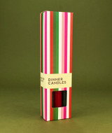 A beautifully illustrated, festive-striped gift box for Heaven Scent's The Christmas Edit mixed dinner candles, displayed alongside six straight, hand-poured artisan dinner candles in complementary shades of Elephant Grey, Christmas Red and Dark Green.