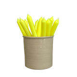Several pastel green artisan dinner candles displayed together in a stylish ceramic pot, showcasing their soft shade and premium hand-poured finish.