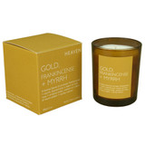 Gold, Frankincense & Myrrh 20cl amber glass scented candle from the Modern Heritage collection, shown beside its gold gift box.
