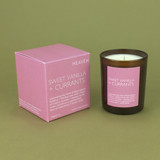 Sweet Vanilla & Currants 20cl amber glass scented candle from the Modern Heritage collection, shown beside its pink gift box.