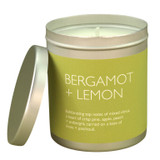 Bergamot & Lemon 200ml Travel Tin candle from the Modern Heritage collection, shown with the lid off and a beautiful citrus green label.