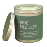 Pine Needles 200ml Travel Tin Christmas candle from the Modern Heritage collection, shown with the lid off and a beautiful dark green  label.