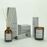 Black Pomegranate 20cl amber glass scented candle,  100ml Reed Diffuser & 60ml Cocoa & Shea Butter from the Modern Heritage collection, shown beside their gift boxes.