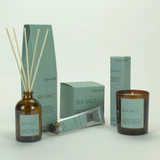 Sea Salt 20cl amber glass scented candle, 100ml reed diffuser and 60ml cocoa & shea butter hand cream from the Modern Heritage collection, shown beside its sea foam blue gift box.
