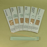 Green botanical incense sticks displayed in their green botanical card packs, showcasing the handmade British finish.
