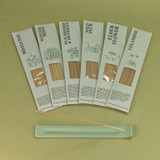 Green botanical incense sticks displayed in their green botanical card packs, showcasing the handmade British finish.