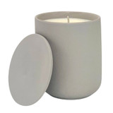 Oud and Tobacco Leaf scented candle in a light grey ceramic pot with matching lid alongside a gift box