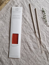 Sage and cypress artisan incense sticks displayed next to their pastel heritage card pack, showcasing the handmade British finish.