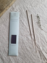 Inspiration artisan incense sticks displayed next to their pastel heritage card pack, showcasing the handmade British finish.