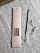 Relaxing artisan incense sticks displayed next to their pastel heritage card pack, showcasing the handmade British finish.