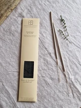 Rosemary and thyme artisan incense sticks displayed next to their pastel heritage card pack, showcasing the handmade British finish.