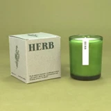 20cl natural soy wax Herb-scented candle in a beautiful green glass jar, next to its recycled presentation box.