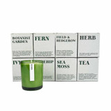 20cl natural soy wax Herb-scented candle in a beautiful green glass jar, next to its recycled presentation box.