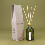 Heaven Scent Rosehip scented reed diffuser set, including the green glass bottle, rattan sticks and a recycled gift box.