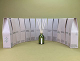 Heaven Scent Sea Moss scented reed diffuser set, including the green glass bottle, rattan sticks and a recycled gift box.