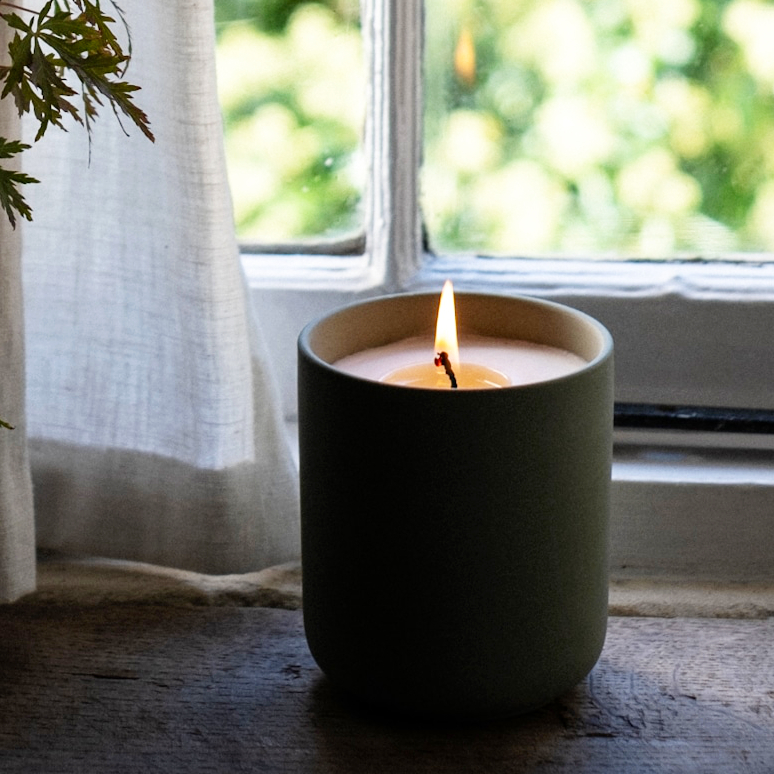 Heaven Scent's Ceramic Pot filled with a natural soy wax candle.