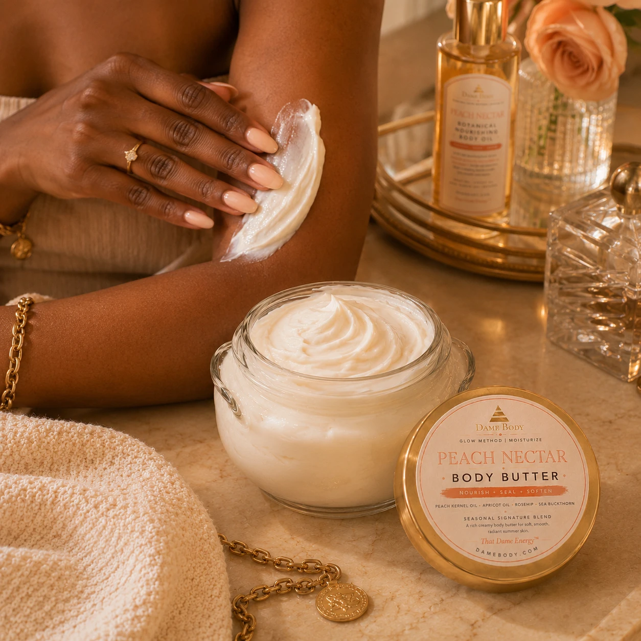 Gentle Peach Nectar Body Butter application on the leg beside the matching body oil