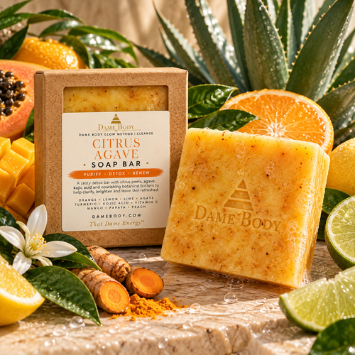 Dame Body Citrus Agave Soap Bar in kraft square-window box with unboxed golden botanical cleansing bar