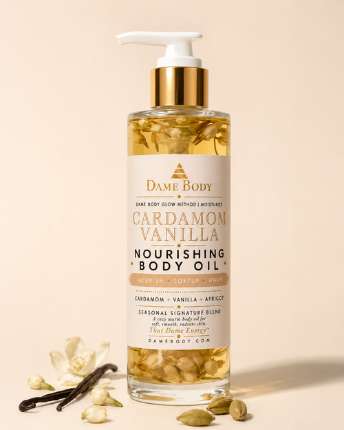 Dame Body Cardamom Vanilla Nourishing Body Oil featuring vanilla bean, cardamom pods, jasmine buds, chamomile, argan oil, macadamia nut oil, and pumpkin seed oil for soft glowing skin.