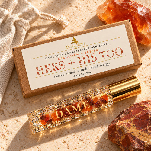 Hers + His Too crystal roller and copper label kraft box with raw Carnelian and Jasper stones in warm golden light