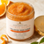 Open Citrus Agave Body Scrub showing thick orange citrus exfoliating texture