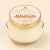 Citrus + Agave Body Butter in a clear glass jar with its current cream, orange and gold Dame Body lid label.