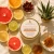 Citrus + Agave Body Butter with its orange label among grapefruit, orange, lemon, lime and botanical aroma imagery.