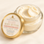 Open Dame Body Baby Body Butter showing rich creamy whipped texture