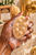 Dame Body Mini Soap Bar held in deep brown manicured hand with creamy lather