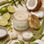 Lime + Coconut Body Scrub ingredient story with fresh lime, coconut, aloe, and creamy exfoliating body scrub.