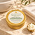 Gold Tin Body Butter beside a folded towel, basin and butter scoop for the Choose Your Moisture step; Serenity Green Tea is shown.