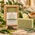 Dame Body Serenity Green Tea Soap Bar in kraft square-window box with unboxed green botanical cleansing bar