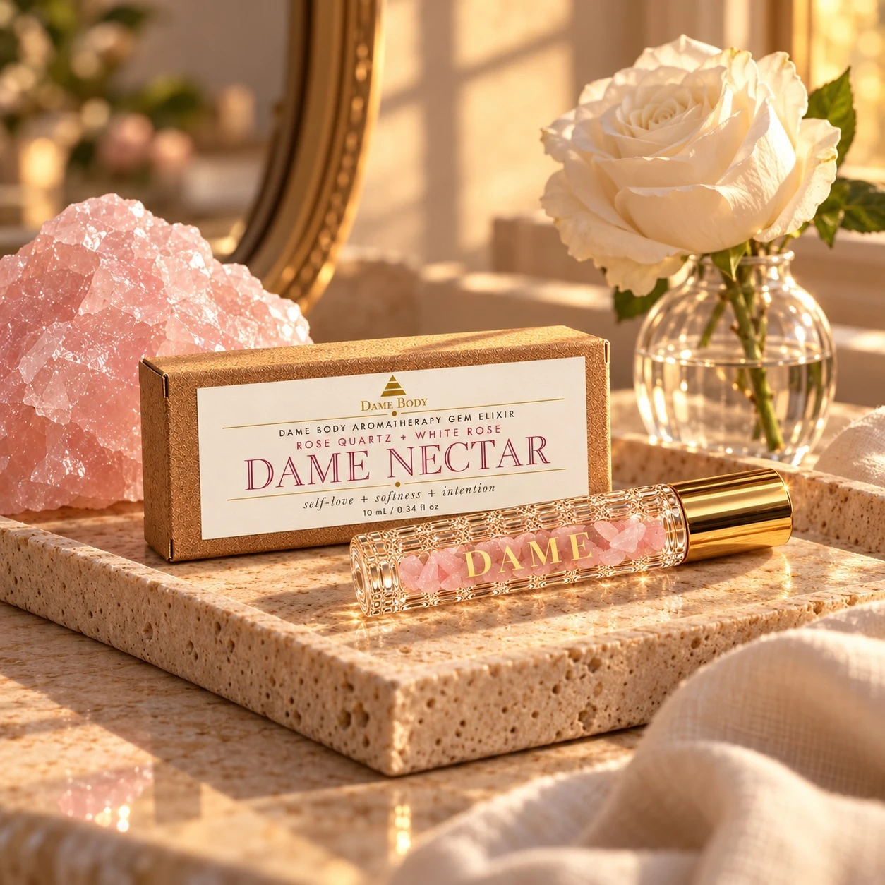 Dame Nectar roller and labeled kraft box in a warm Rose Quartz vanity scene.