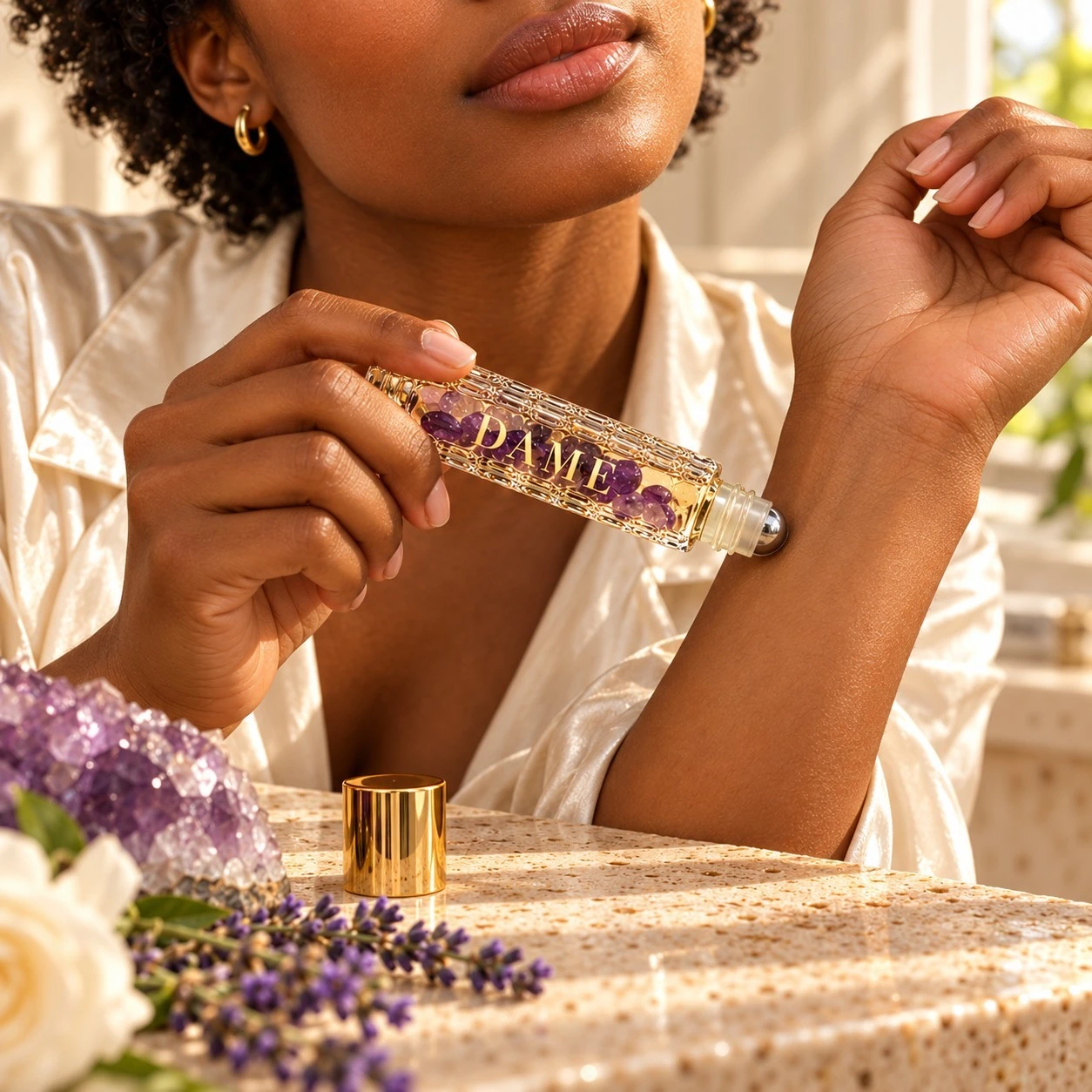 Applying Jasmine Rose crystal roller to the inner wrist